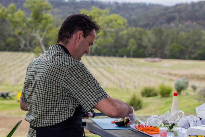 a man that is standing in the grass